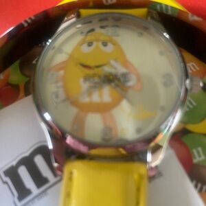 Avon M&M watch in tin Vintage never used. Has always been kept in box in tin